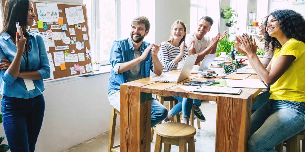 Group clapping at presentation