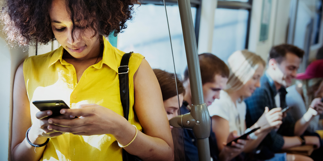 Person on Tube checking social media